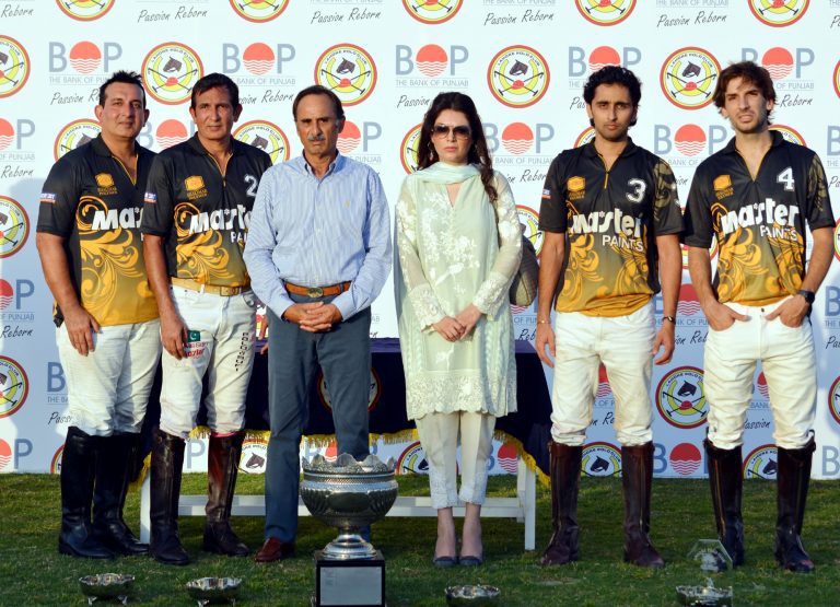 BoP Polo Cup Winning team Master Paints with the trophy