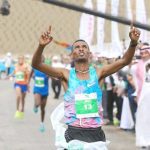 Ethiopian runner Tamire Molla celebrates after winning