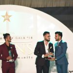 Shadab Khan handing over trophy to Faheem Ashraf