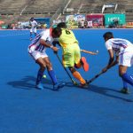 SNGPL player goes past 2 WAPDA players