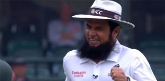 Cricket Records: Aleem Dar Umpire With Most ODIs Cricket umpire with a beard, wearing an ICC hat, smiling and celebrating during a match. The image captures his joyful reaction after making a significant decision, highlighting his role in setting cricket umpire records.